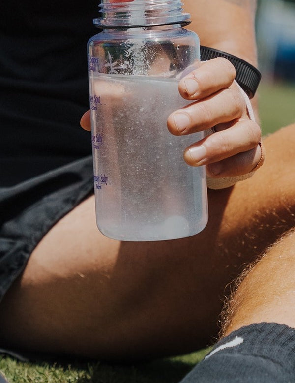 Sodii Salty Raspberry hydration drink being prepared outdoors