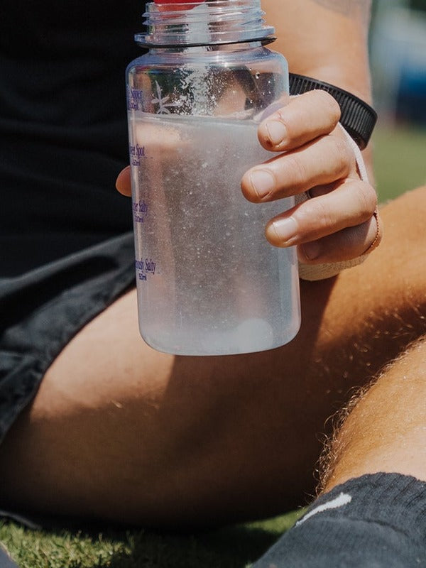 Sodii Salty Raspberry hydration drink being prepared outdoors