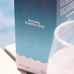 Sodii Everyday Hydration Salts Unflavoured styled beside a drinking glass
