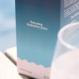 Sodii Everyday Hydration Salts Unflavoured styled beside a drinking glass
