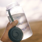 Sodii Everyday Hydration Salts Unflavoured mixed in a reusable water bottle outdoors