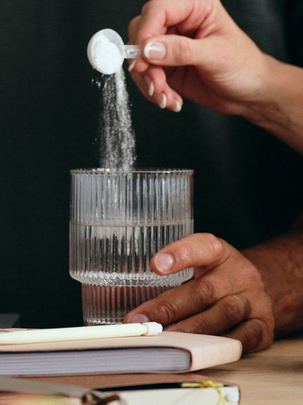 Sodii Unflavoured hydration salts being scooped into water