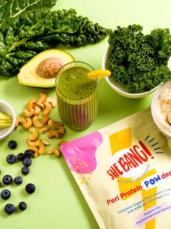 She BANG! Vanilla Peri Protein POWder styled with colourful fruit and drinks