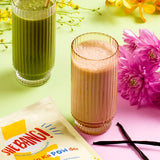 She BANG! Vanilla Peri Protein POWder styled with flowers and prepared drinks