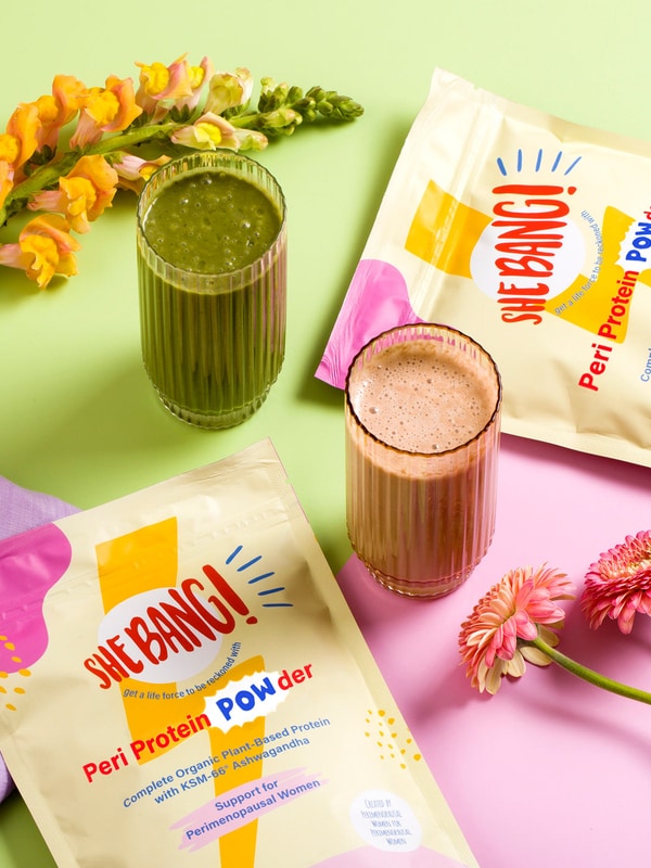 She BANG! Vanilla Peri Protein POWder styled with green smoothie ingredients
