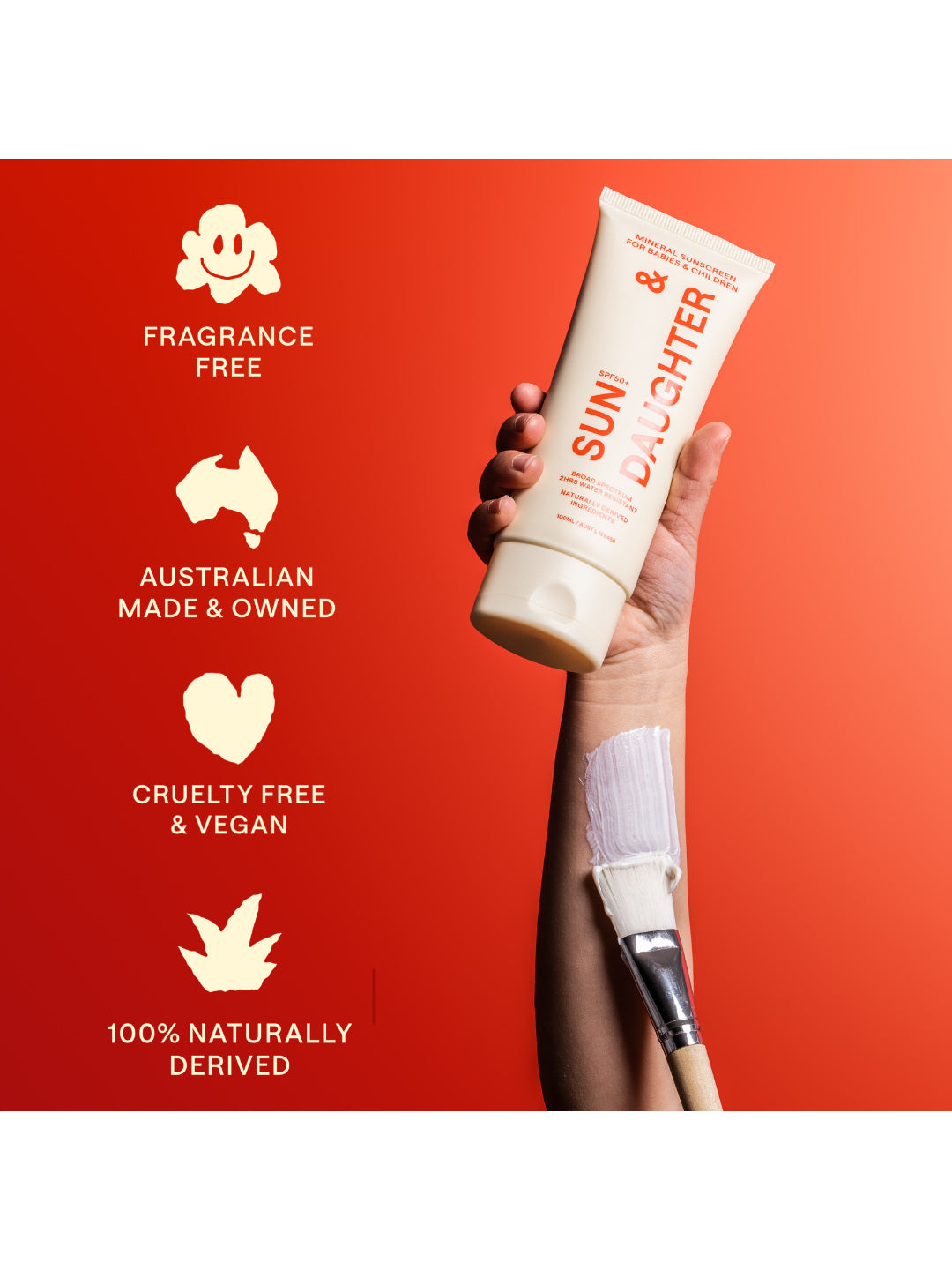 A hand holds the ivory Sun & Daughter mineral sunscreen tube against a red and coral background, beside icons labelled fragrance free, Australian made and owned, cruelty free and vegan, and 100% naturally derived.