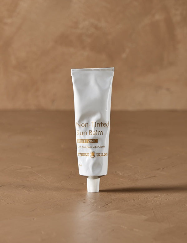 Non Tinted Sun Balm tube in warm natural light – Thrive Tallow Sun Balm with Zinc Oxide - Non Tinted 70ml