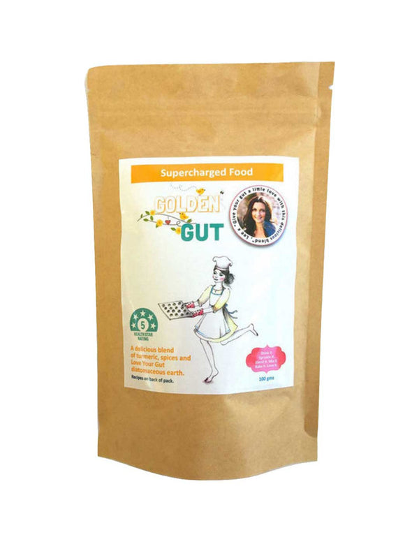 A brown resealable pouch labeled Supercharged Food Golden Gut 100g shows a chef-hatted woman holding a tray and a circular badge with her photo. This turmeric superfood blend is designed to support digestive wellness.