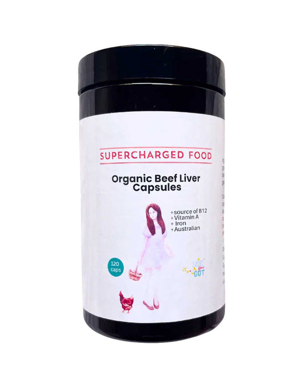 A black container of Supercharged Food Love Your Gut Organic Beef Liver Capsules (120 caps), featuring a label with a woman, a cat, and details like grass-fed, freeze-dried, B12, vitamin A, and made in Australia.