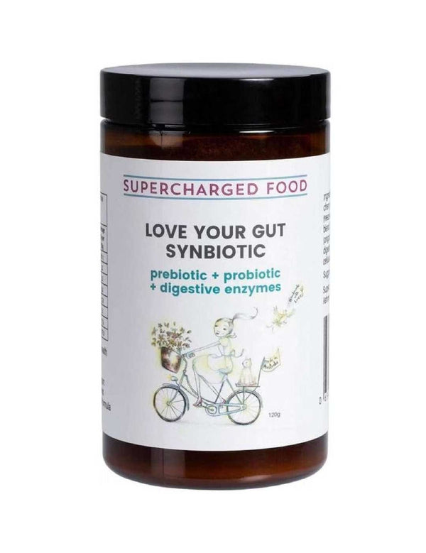 A brown jar labeled Supercharged Food Love Your Gut Synbiotic Powder 120g, featuring prebiotics, probiotics, and digestive enzymes. The label shows a person riding a bicycle with flowers.