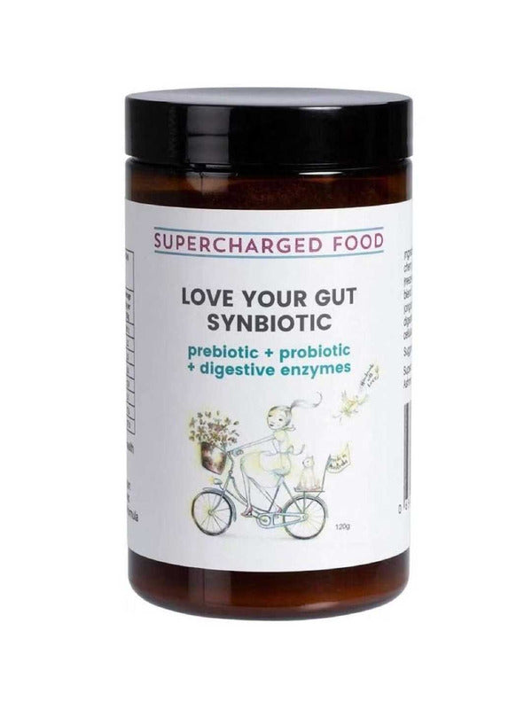 A brown jar labeled Supercharged Food Love Your Gut Synbiotic Powder 120g, featuring prebiotics, probiotics, and digestive enzymes. The label shows a person riding a bicycle with flowers.
