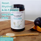 Love Your Gut Synbiotic styled with fruit and serving spoon on the official product page