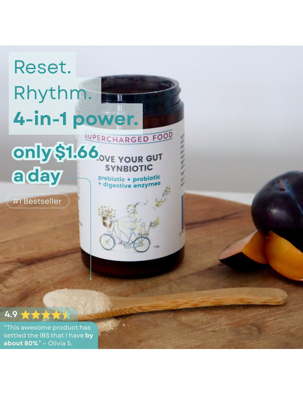 Love Your Gut Synbiotic styled with fruit and serving spoon on the official product page