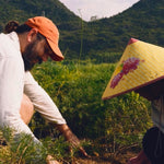 Farmers harvesting herbs in a mountainous growing region