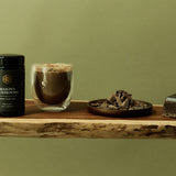 Mason's Mushrooms beside a prepared tonic and mushrooms