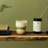 SuperFeast Reishi beside a creamy tonic in a daily ritual
