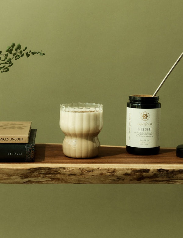 SuperFeast Reishi beside a creamy tonic in a daily ritual