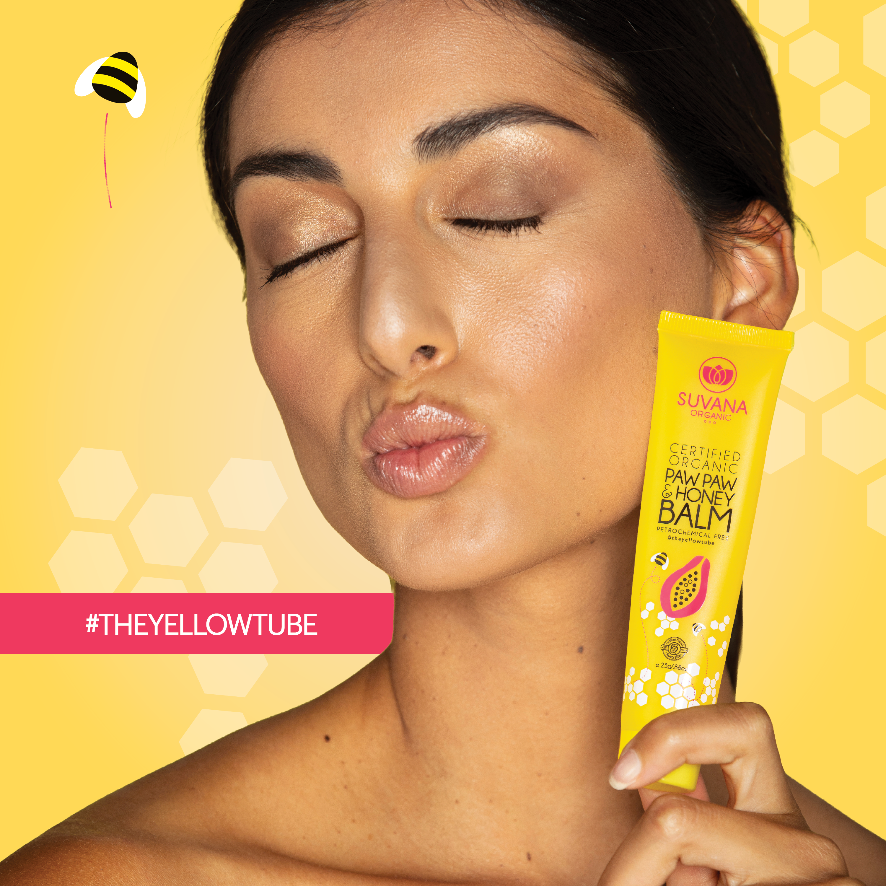 Woman holding Suvana Organic Paw Paw and Honey Balm