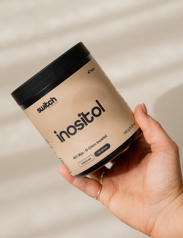Switch Nutrition Inositol Powder held in hand
