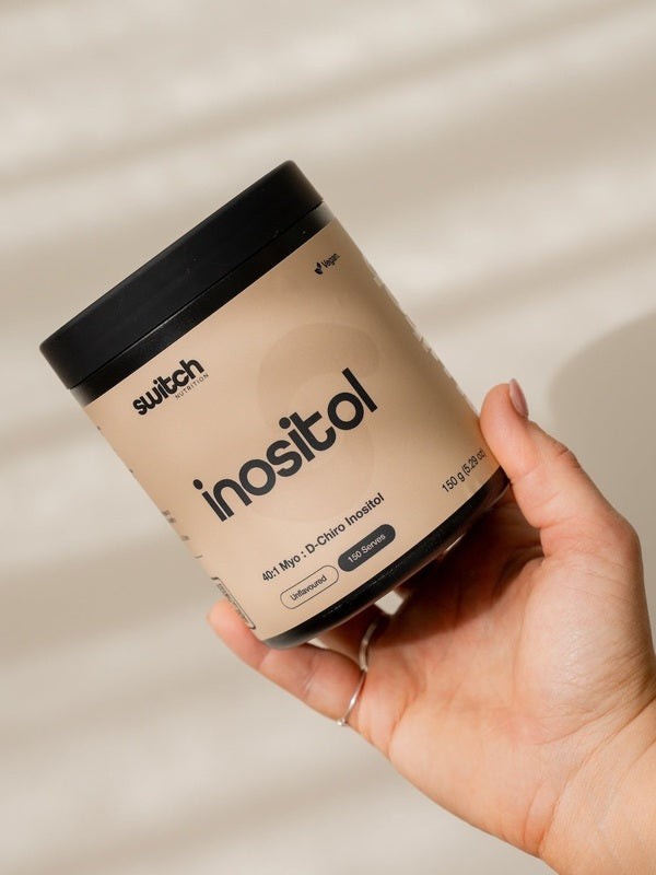 Switch Nutrition Inositol Powder held in hand