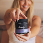Switch Nutrition Sleep+ Capsules held by a woman in a bedroom