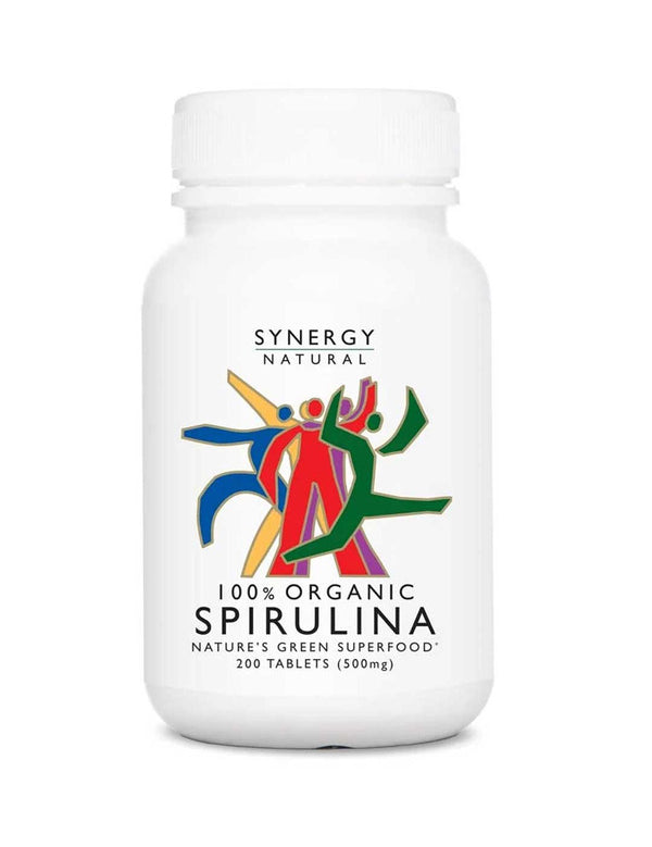 White Synergy Natural Organic Spirulina tablet bottle with rounded shoulders and a white screw cap, with colourful red, green, blue and yellow figures above the black product name.