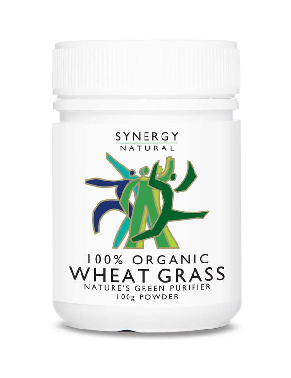 White Synergy Natural Organic Wheat Grass powder bottle with a ribbed white screw lid and green and blue stylised figures above black 'WHEAT GRASS' lettering.