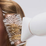 T3 Featherweight StyleMax Hair Dryer in use with brush