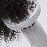 T3 Featherweight StyleMax Hair Dryer in use with diffuser