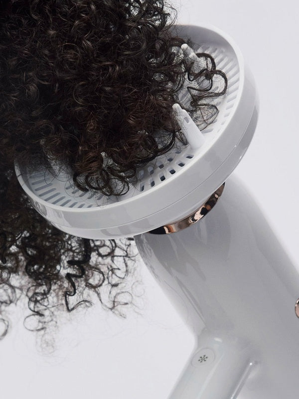 T3 Featherweight StyleMax Hair Dryer in use with diffuser