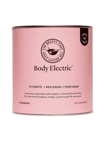 Pink cylindrical The Beauty Chef Body Electric Strawberry canister with thin metal rims, a black circular brand emblem above the product name and a small black creatine badge near the top edge.