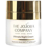 The Jojoba Company Ultimate Night Cream in a frosted jar with a broad, reflective gold top and black lettering.