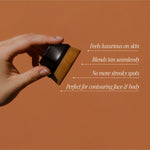 Beauty Buff Brush held in hand with application benefits