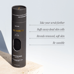 Tall black cylindrical packaging for the Three Warriors Exfoliating Glove, with a window showing its textured surface and text about exfoliation and reuse.