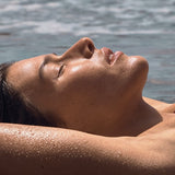 Woman relaxing poolside with a sun kissed glow