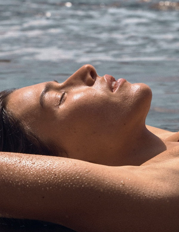 Woman relaxing poolside with a sun kissed glow