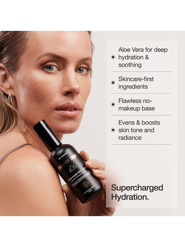 Woman holding Face Tan Aqua Mist with hydration benefits