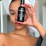 Woman holding Three Warriors Face Tan Aqua Mist