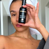 Woman holding Three Warriors Face Tan Aqua Mist