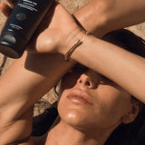 Woman holding Three Warriors Gradual Tan outdoors