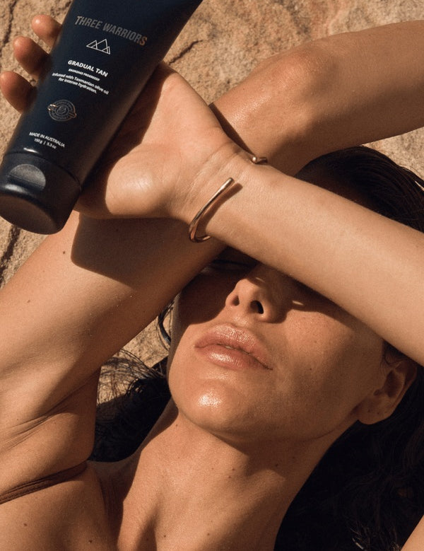 Woman holding Three Warriors Gradual Tan outdoors