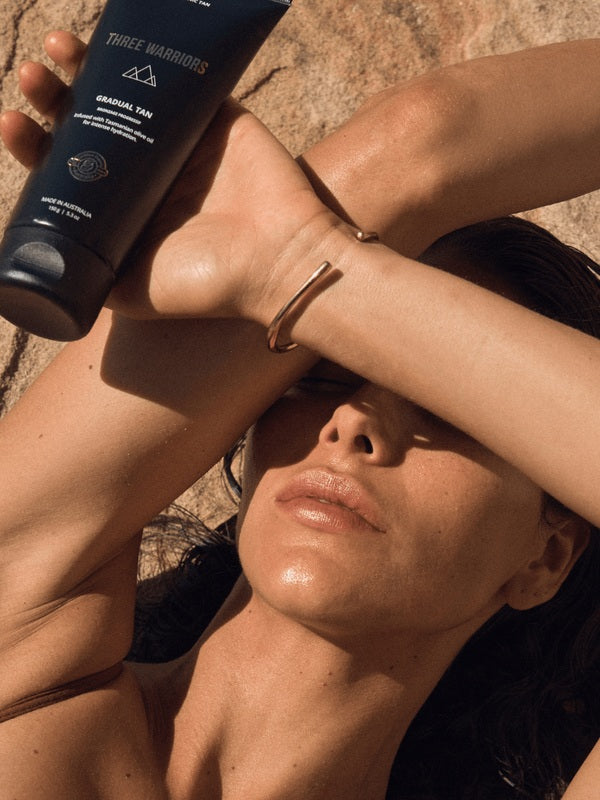 Woman holding Three Warriors Gradual Tan outdoors
