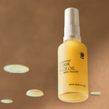 Thrive Tallow Hydrating Elixir Face Oil with droplets in warm light