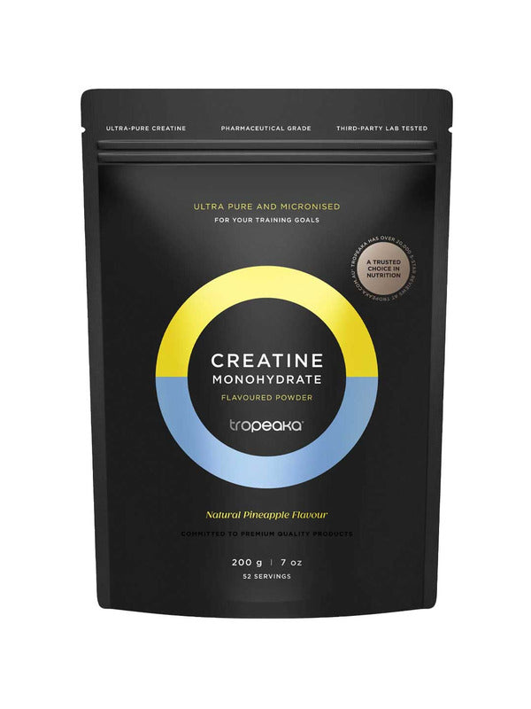 A black pouch of Tropeaka Creatine Monohydrate Pineapple 200g offers 52 servings of ultra-pure, micronized creatine with natural pineapple flavour to support muscle strength. The packaging features yellow and blue accents.