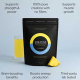 A black pouch of Tropeaka Creatine Monohydrate Pineapple 200g sits beside a glass of yellow pineapple drink and a pineapple slice, with text showing benefits such as muscle strength, energy, brain support, purity, and lab testing.