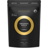 Black resealable Tropeaka Organic Maca Powder pouch with a gold circular design framing the product name in white.
