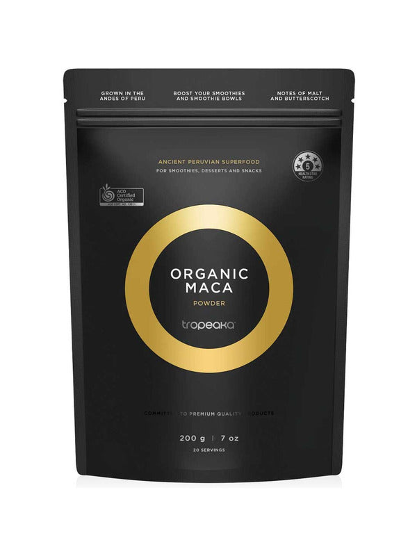 Black resealable Tropeaka Organic Maca Powder pouch with a gold circular design framing the product name in white.