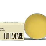 Open tin of Tuttofare Holy Grail Tallow Balm on a cream background