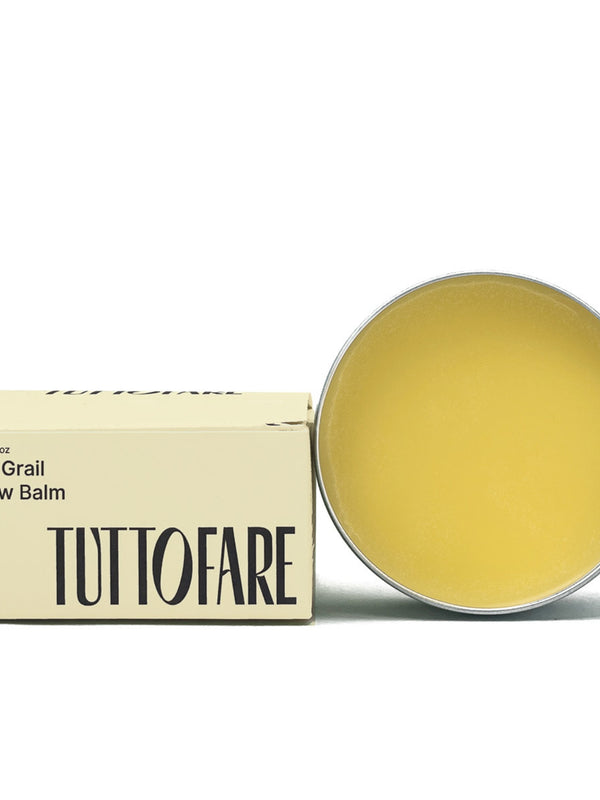 Open tin of Tuttofare Holy Grail Tallow Balm on a cream background