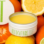Tuttofare Sicilian Citrus Tallow Balm among fresh citrus fruit
